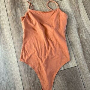 Orange bodysuit